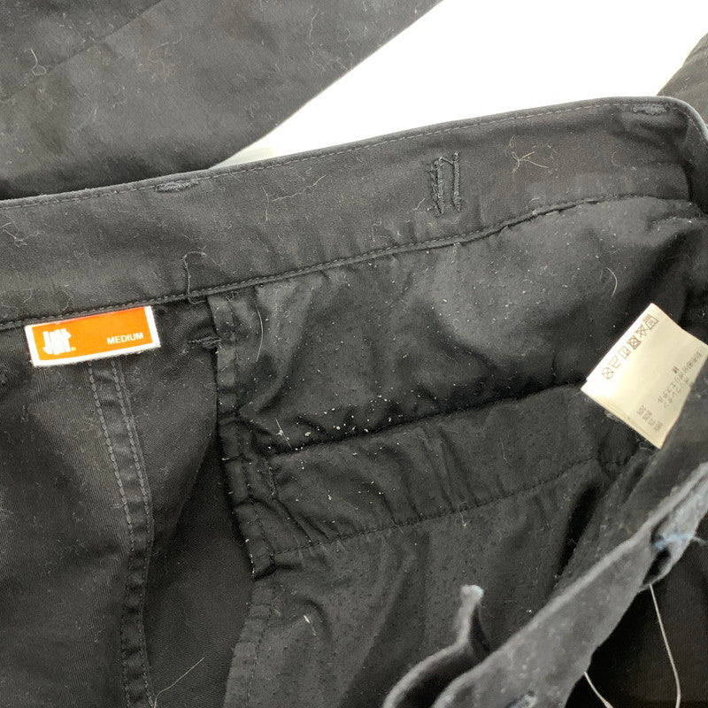 【中古品】【メンズ】 UNDEFEATED アンディフィーテッド カーゴパンツ ボトムス ブランド 古着 153-260921-gm-09-fuzh サイズ:M カラー:ブラック 万代Net店