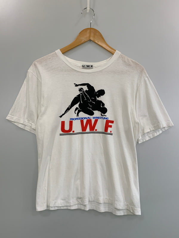 【中古品】【メンズ】 U.W.F. 80S PROFESSIONAL WRESTLING TEE ユニバーサル レスリング プロレス 半袖Tシャツ 146-260714-ta-20-min サイズ：サイズ不明 カラー：ホワイト 万代Net店