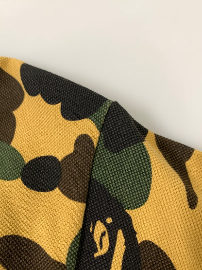 【中古品】【メンズ】 A BATHING APE アベイシングエイプ 1ST CAMO ONE POINT REGULAR FIT POLO SHIRT ファースト カモ ワンポイント レギュラー フィット ポロシャツ 半袖 メンズ 142-260723-em-40-min サイズ：L カラー：マスタード系 万代Net店