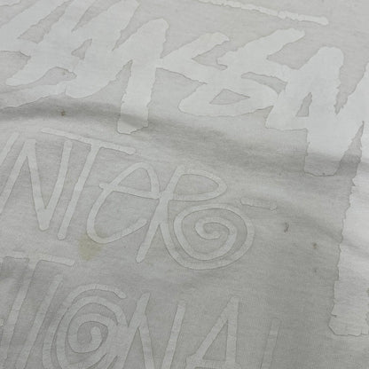 【中古品】【メンズ】 STUSSY ステューシー 金タグ LOCAL COLOR SNDI INTERNATIONAL TRIBE TEE ローカル カラー インターナショナル トライブ Tシャツ トップス 142-260602-kh-06-izu サイズ：XXL カラー：ホワイト 万代Net店