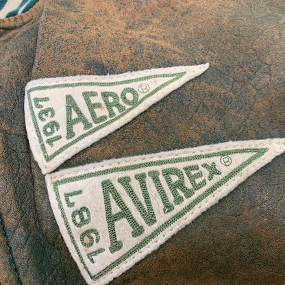 【現状渡し品】【メンズ】 AVIREX アヴィレックス AMERICAN CLASSICS アメリカン クラシックス 切替 AVIREX TRACK USA LEATHER JACKET レザー ジャケット アウター 146-260909-cs-11-izu サイズ：L カラー：グリーン系 万代Net店