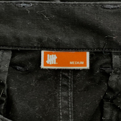 【中古品】【メンズ】 UNDEFEATED アンディフィーテッド カーゴパンツ ボトムス ブランド 古着 153-260921-gm-09-fuzh サイズ：M カラー：ブラック 万代Net店