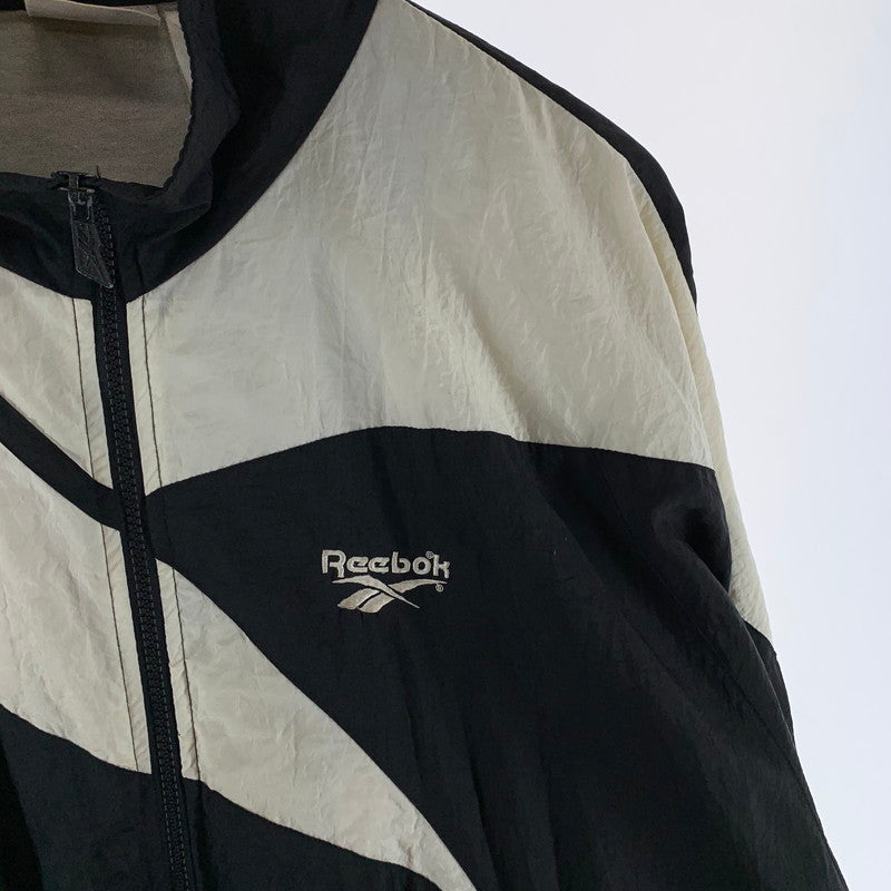 【中古品】【メンズ】 REEBOK リーボック NYLON JACKET ナイロンジャケット ブルゾン 古着 145-261018-gm-17-fuzh サイズ：L カラー：ブラック ホワイト 万代Net店
