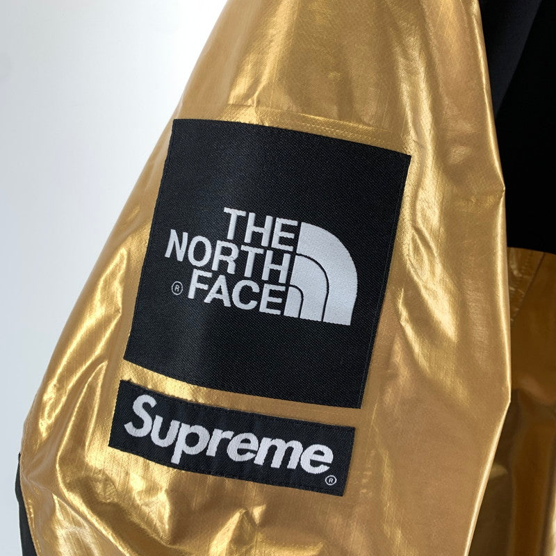 【中古品】【メンズ】 SUPREME シュプリーム × THE NORTH FACE ザ・ノースフェイス NP11801I 18SS METALLIC MOUNTAIN PARKA メタリック マウンテン パーカー ジャケット アウター コート 古着 149-261012-mh-07-fuzh サイズ：M カラー：ゴールド・ブラック 万代Net店