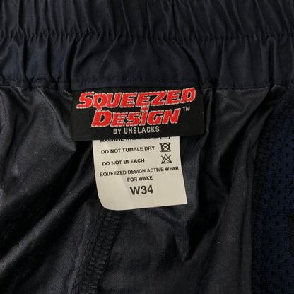 【中古品】【メンズ】  SQUEEZED DESIGN BY UNSLACKS スクイーズデザイン バイ アンスラックス NYLON 2TUCK WIDE PANTS ナイロン 2タック ワイドパンツ ボトムス 151-241117-kk-20-tei サイズ：34 カラー：ネイビー 万代Net店