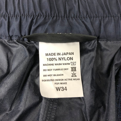 【中古品】【メンズ】  SQUEEZED DESIGN BY UNSLACKS スクイーズデザイン バイ アンスラックス NYLON 2TUCK WIDE PANTS ナイロン 2タック ワイドパンツ ボトムス 151-241117-kk-20-tei サイズ：34 カラー：ネイビー 万代Net店