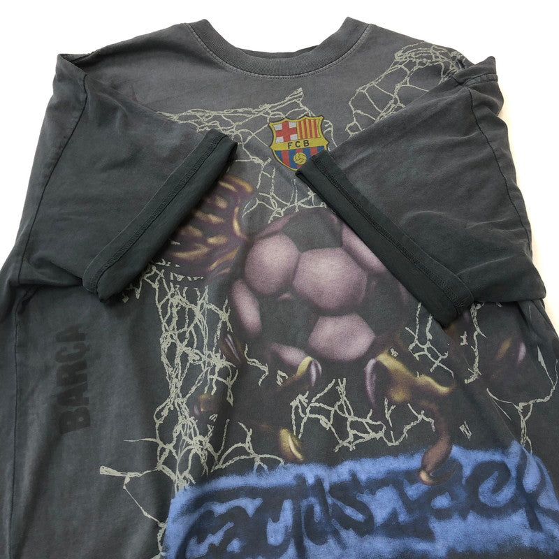 【中古品】【メンズ】 TRAVIS SCOTT CACTUS JACK トラビス・スコット カクタスジャック × FCB FCバルセロナ 別注 コラボ CJ X FCB WASHED SPRAY LOGO TEE ウォッシュド スプレー ロゴ Tシャツ トップス 142-250818-KS-10-tei サイズ：XL カラー：ブラック 万代Net店
