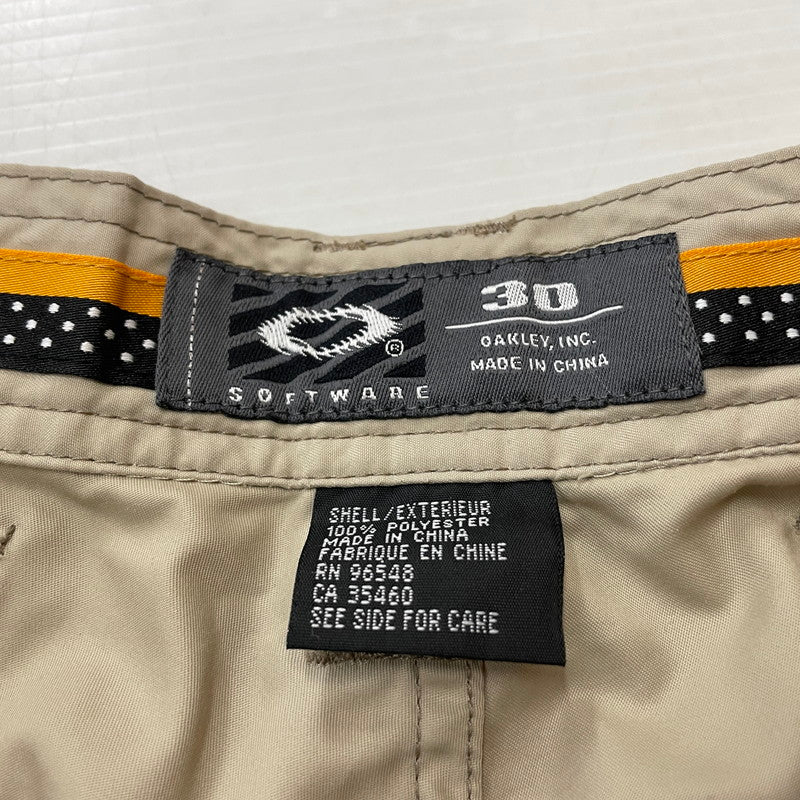 【中古品】【メンズ】 OAKLEY オークリー SOFTWARE GIMMICK SHELL PANTS ソフトウェア ギミック シェルパンツ ボトムス 159-260221-yo-08-tei サイズ：30 カラー：ベージュ 万代Net店