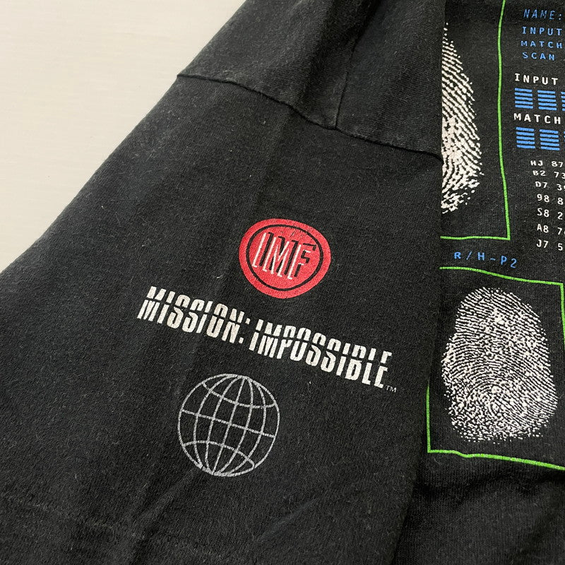 【中古品】【メンズ】 UNKNOWN 90's APPLE アンノウン 90年代 アップル × MISSION IMPOSSIBLE ミッションインポッシブル 別注コラボ EXPECT THE IMPOSSIBLE エクスペクト ザ インポッシブル 半袖 トップス 145-260615-sa-07-tei サイズ：不明 カラー：ブラック 万代Net店