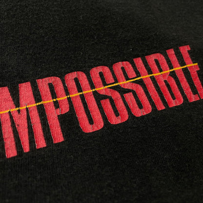 【中古品】【メンズ】 UNKNOWN 90's APPLE アンノウン 90年代 アップル × MISSION IMPOSSIBLE ミッションインポッシブル 別注コラボ EXPECT THE IMPOSSIBLE エクスペクト ザ インポッシブル 半袖 トップス 145-260615-sa-07-tei サイズ：不明 カラー：ブラック 万代Net店