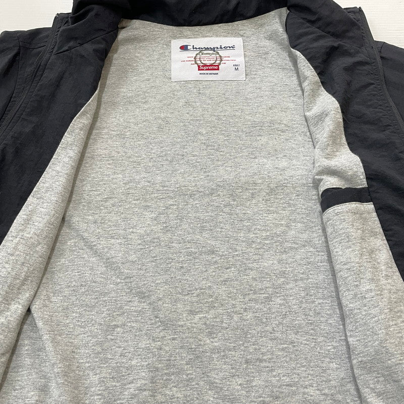 【中古品】【メンズ】 SUPREME シュプリーム × CHAMPION チャンピオン 18SS TRACK JACKET 2018年春夏 トラック ジャケット アウター 149-260817-sa-02-teih サイズ：M カラー：ブラック 万代Net店