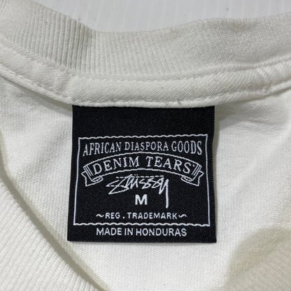 【中古品】【メンズ】 STUSSY ステューシー × DENIM TEARS デニムティアーズ 別注コラボ ANNIE LEE TEE アニーリー Tシャツ 半袖 トップス 142-260831-yo-03-tei サイズ：M カラー：ホワイト 万代Net店