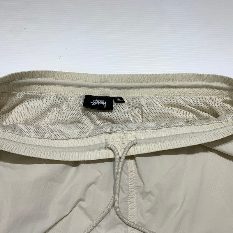 【中古品】【メンズ】 STUSSY ステューシー NYLON TRACK PANT 116746 ナイロン トラックパンツ ボトムス イージーパンツ 153-260905-ko-01-teih サイズ：M カラー：ホワイト系/アイボリー系 万代Net店