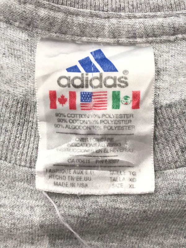 【中古品】【メンズ】 ADIDAS アディダス S/S LAKEWOOD TEE プリント Tシャツ 万国旗タグ USA製 146-260506-na-17-tag サイズ：XL カラー：グレー 万代Net店
