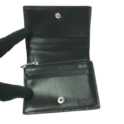 【中古品】【メンズ】 DIESEL ディーゼル ENAMEL MINI WALLET X10121 PR271 T8013 エナメル ミニ ウォレット 二つ折り財布 200-261013-na-29-tagh カラー：ブラック 万代Net店