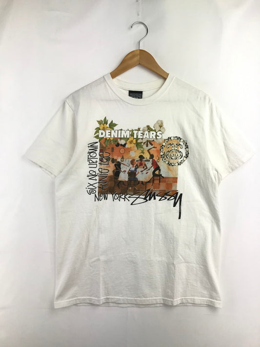 【中古品】【メンズ】 STUSSY ステューシー × DENIM TEARS デニム ティアーズ ANNIE LEE TEE アニメ リー Tシャツ 半袖Tシャツ 142-260523-rt-19-tagh サイズ：M カラー：ホワイト 万代Net店