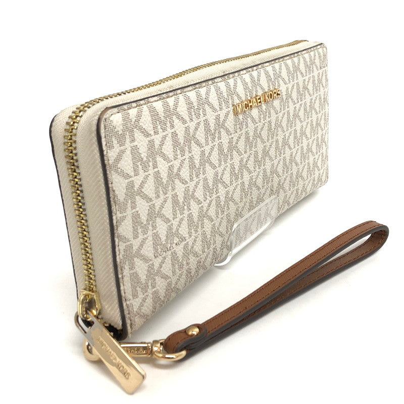 【中古品】【レディース】 MICHAEL KORS マイケルコース 35F8GTVT3B パウダーブラッシュマルチ ジェット セット トラベル シグネチャー ラージ トラベル コンチネンタル ラウンド ジップ 長財布 181-260521-rs-06-fur カラー：バニラ 万代Net店