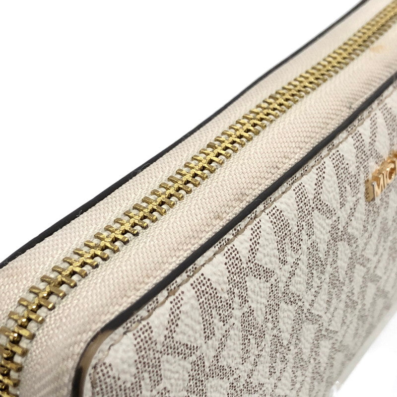 【中古品】【レディース】 MICHAEL KORS マイケルコース 35F8GTVT3B パウダーブラッシュマルチ ジェット セット トラベル シグネチャー ラージ トラベル コンチネンタル ラウンド ジップ 長財布 181-260521-rs-06-fur カラー：バニラ 万代Net店